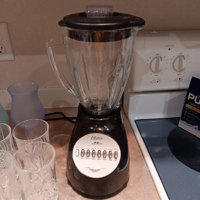OSTER BLENDER, 7 CRYSTAL DRINKING GLASSES AND 3 STEMMED GLASSES