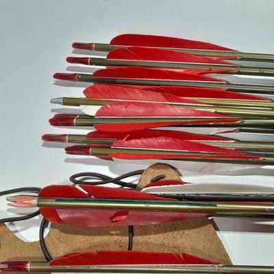 Arrows and wrist guards for a bow - At least a dozen arrows