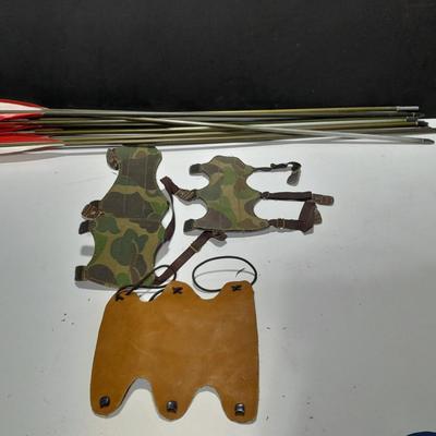 Arrows and wrist guards for a bow - At least a dozen arrows