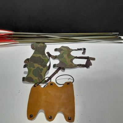 Arrows and wrist guards for a bow - At least a dozen arrows