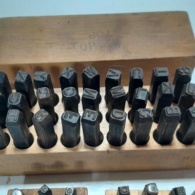 Sets of Machine-made Steel stamps in wooden organizer boxes