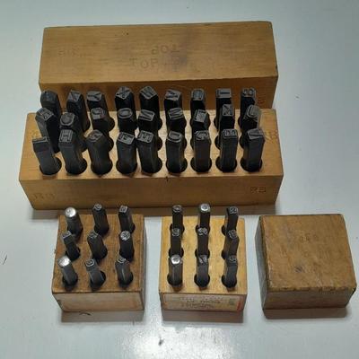 Sets of Machine-made Steel stamps in wooden organizer boxes