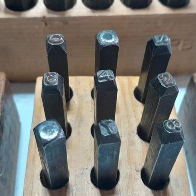 Sets of Machine-made Steel stamps in wooden organizer boxes