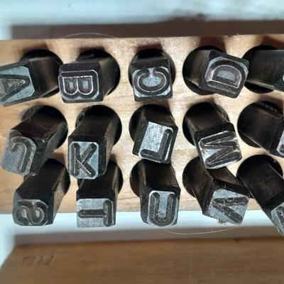 Sets of Machine-made Steel stamps in wooden organizer boxes