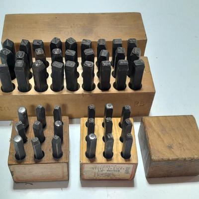 Sets of Machine-made Steel stamps in wooden organizer boxes