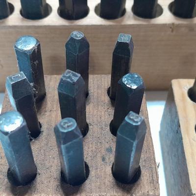 Sets of Machine-made Steel stamps in wooden organizer boxes