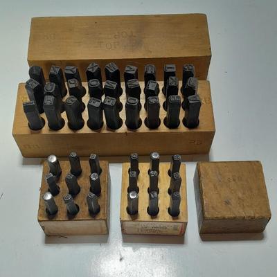 Sets of Machine-made Steel stamps in wooden organizer boxes