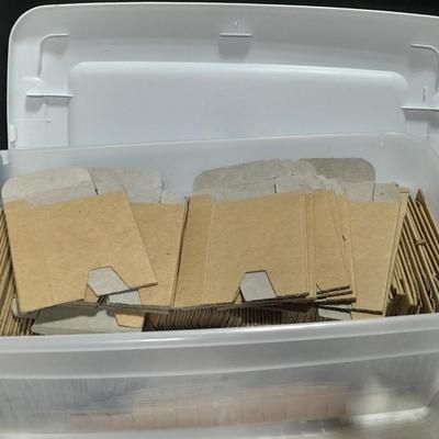 Small tote of cardboard Ammunition sleeves