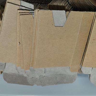 Small tote of cardboard Ammunition sleeves