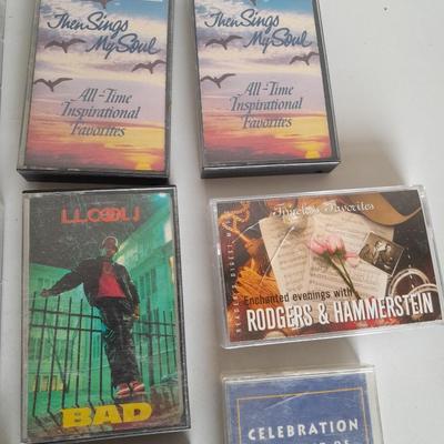 Variety of cassette tapes with cassette player