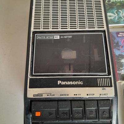 Variety of cassette tapes with cassette player