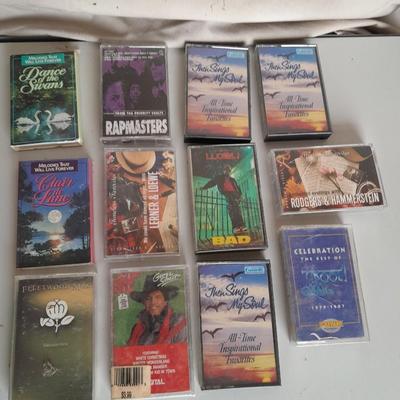 Variety of cassette tapes with cassette player