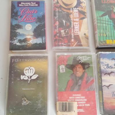 Variety of cassette tapes with cassette player