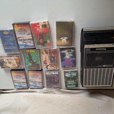 Variety of cassette tapes with cassette player