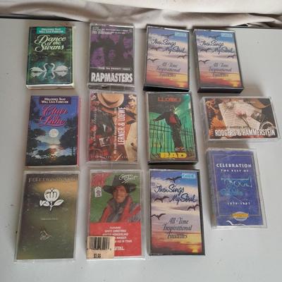 Variety of cassette tapes with cassette player