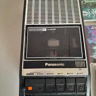 Variety of cassette tapes with cassette player