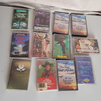 Variety of cassette tapes with cassette player