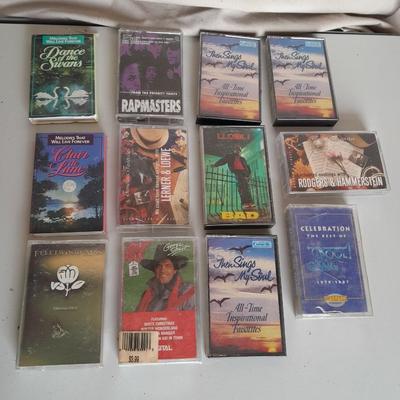 Variety of cassette tapes with cassette player