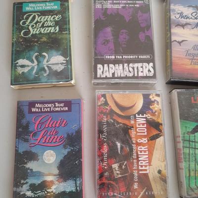 Variety of cassette tapes with cassette player
