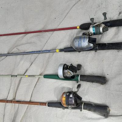 Four fishing poles with reels
