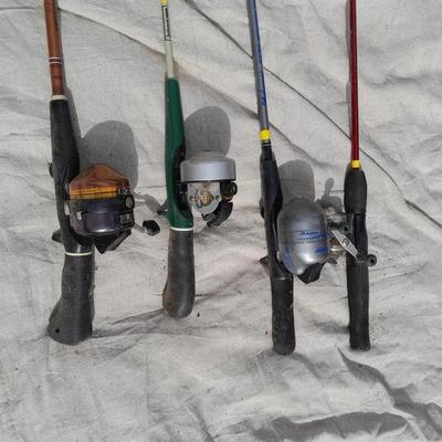 Four fishing poles with reels