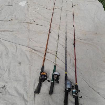 Four fishing poles with reels