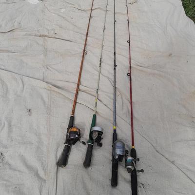 Four fishing poles with reels