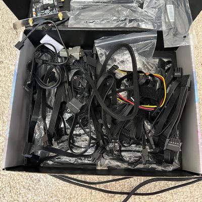 AN ASSORTMENT OF COMPUTER/ELECTRONIC CORDS AND FANS