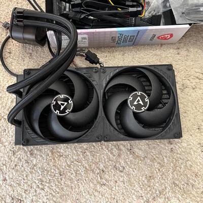 AN ASSORTMENT OF COMPUTER/ELECTRONIC CORDS AND FANS
