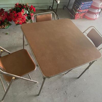 Table and three chairs