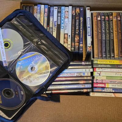 Large DVD Lot including on Portable DVD Holder with DVDs inside