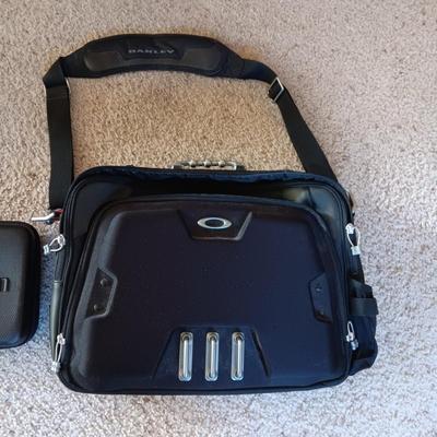 OAKLEY SOFT SIDED BRIEFCASE AND UNIDEN ZIPPERED CASE
