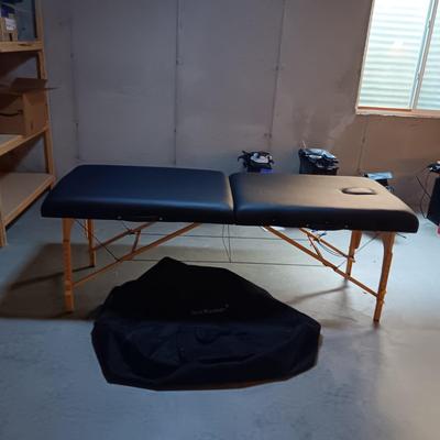 LIKE NEW PORTABLE MASSAGE TABLE WITH CANVAS CARRY CASE