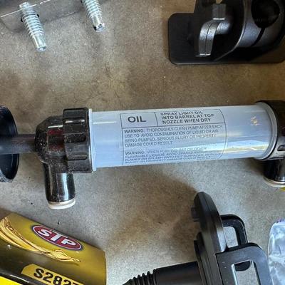 GSPSCN PROFESSIONAL TIRE INFLATOR, LUG NUTS, OIL AND FUEL FILTER, GLOVES, MUFFLER CLAMP AND OTHER ITEMS