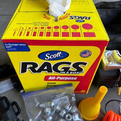 GSPSCN PROFESSIONAL TIRE INFLATOR, LUG NUTS, OIL AND FUEL FILTER, GLOVES, MUFFLER CLAMP AND OTHER ITEMS