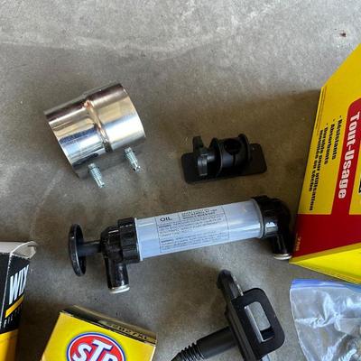 GSPSCN PROFESSIONAL TIRE INFLATOR, LUG NUTS, OIL AND FUEL FILTER, GLOVES, MUFFLER CLAMP AND OTHER ITEMS