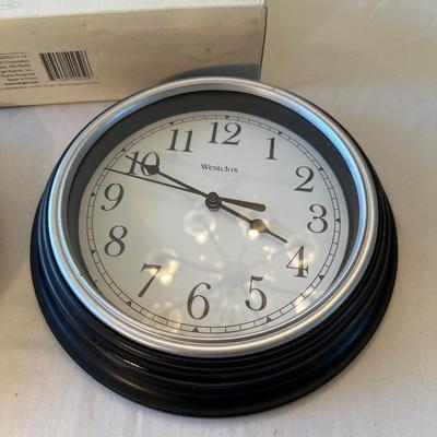 Paper towel holder and two clocks
