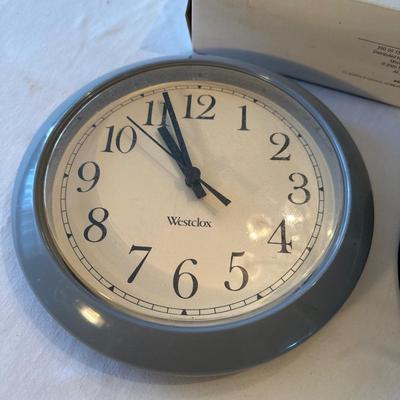 Paper towel holder and two clocks