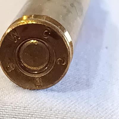 Plastic pencil case full of 5.56 green tip ammunition