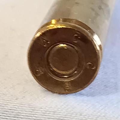 Plastic pencil case full of 5.56 green tip ammunition