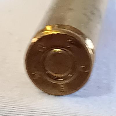 Plastic pencil case full of 5.56 green tip ammunition