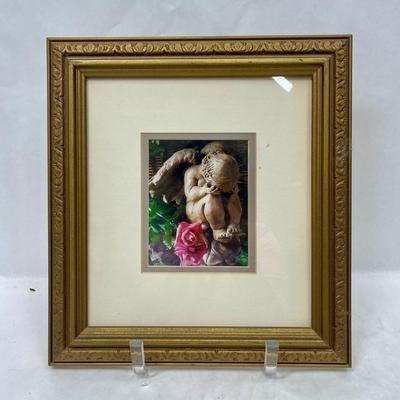 Print of baby angel statue, weeping, framed