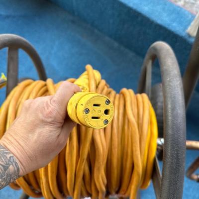Extension cord on wheeled trolley