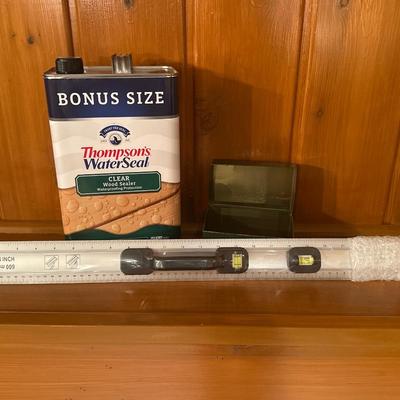 Level, wood sealer, and tin box