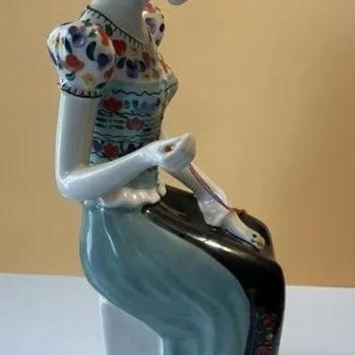 Hungarian Hollohaza Girl Sewing Figurine 9.25" Tall in VG Preowned Condition Preowned from an Estate. Very Nicely Done.