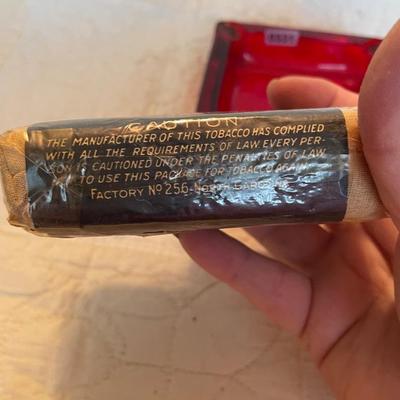 Red label ashtray and smoking tobacco