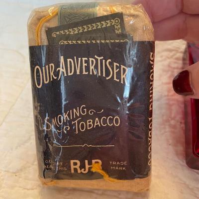 Red label ashtray and smoking tobacco