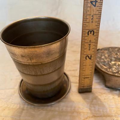 Antique collapsible water cup with ornate lid