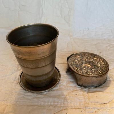 Antique collapsible water cup with ornate lid