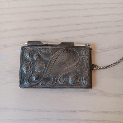 ANTIQUE GERMAN EMBOSSED METAL NOTEPAD WITH PEN AND SMALL PLASTIC POWDER COMPACT